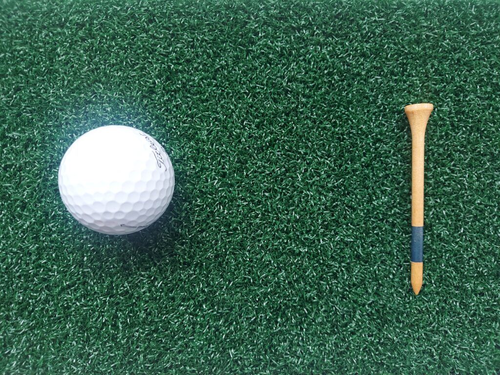 Tee Peg Behind Golf Ball by golfballsworld.com