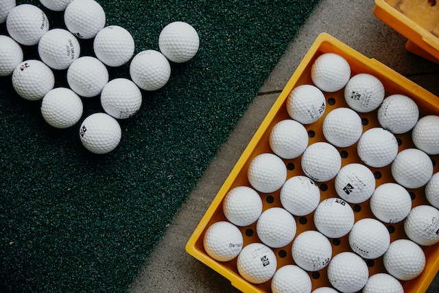 A large number of golf balls by Angelina Yan