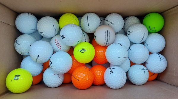 Used golf balls in a box bu golfballsworld.com