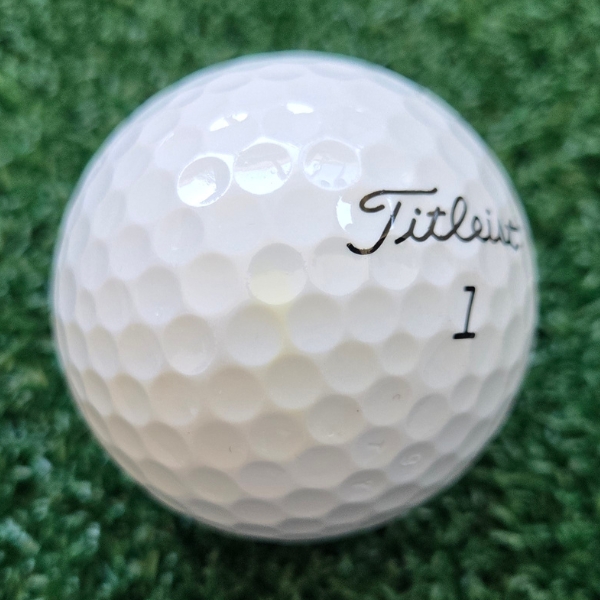 2024 Titleist Tour Soft Golf Ball showing marks and scuffs on the ball after a round of golf