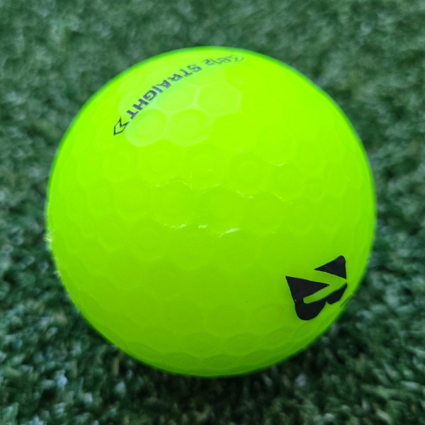 2025 Bridgestone e12 Straight Matte Green Golf Ball showing scuffs and marks on the ball after a round of golf