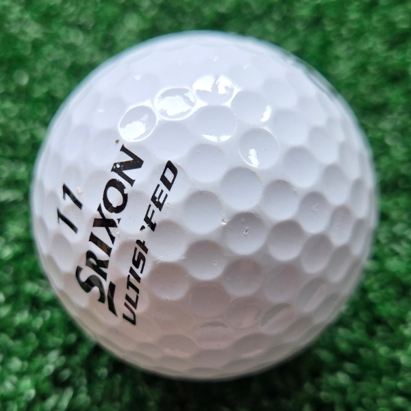 2025 Srixon Ultispeed Golf Ball showing scuffs and marks on the ball after a round of golfing