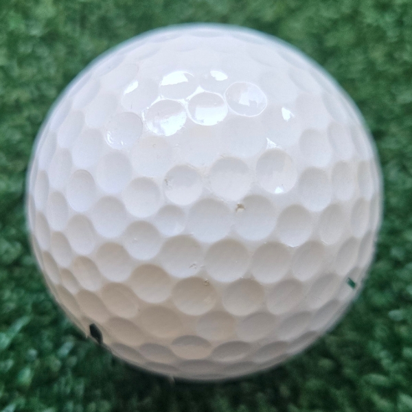2025 Srixon Soft Feel golf ball showing the scuffs and marks after a round of golf