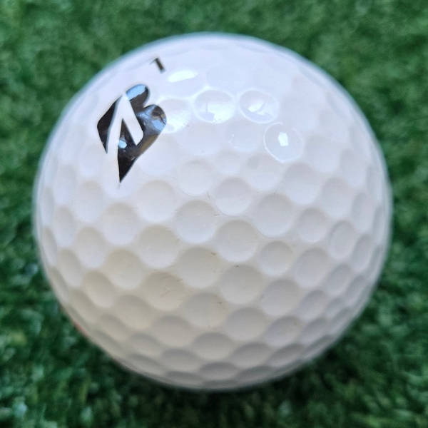2025 Bridgestone e12 HiLaunch Golf Ball showing scuffs and marks on the ball after one round of golf