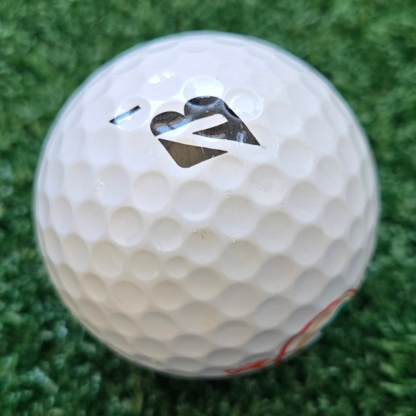 2025 Bridgestone e12 HiLaunch Golf Ball showing scuffs and marks on the ball after one round of golf
