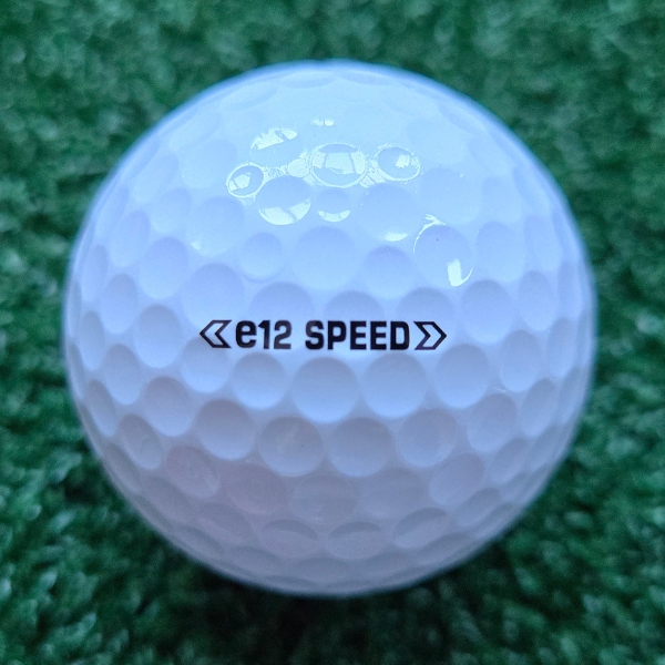 2025 Bridgestone e12 Speed Golf Ball showing the putting alignment which says e12 Speed with a couple of small arrows on each side