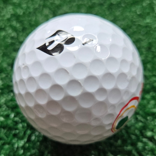 2025 Bridgestone e12 Speed Golf Ball showing scuffs and marks on the golf ball after a round of golf