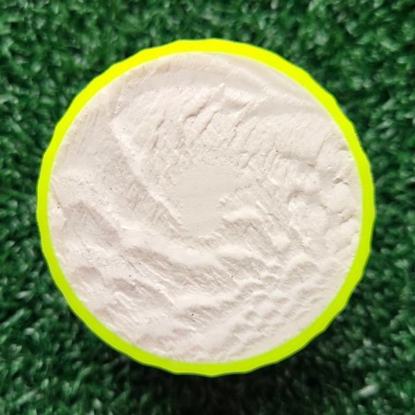 2025 Bridgestone e6 Soft Optic Yellow Golf Ball split in half showing the ball core