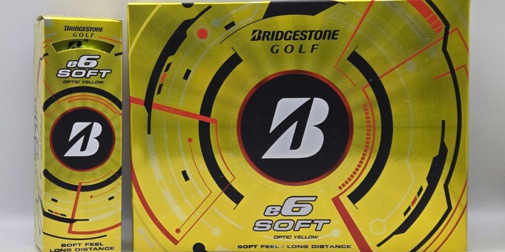 2025 Bridgestone e6 Soft Optic Yellow Golf Ball Review - A Durable Marshmallow text over a blurred golf balls image